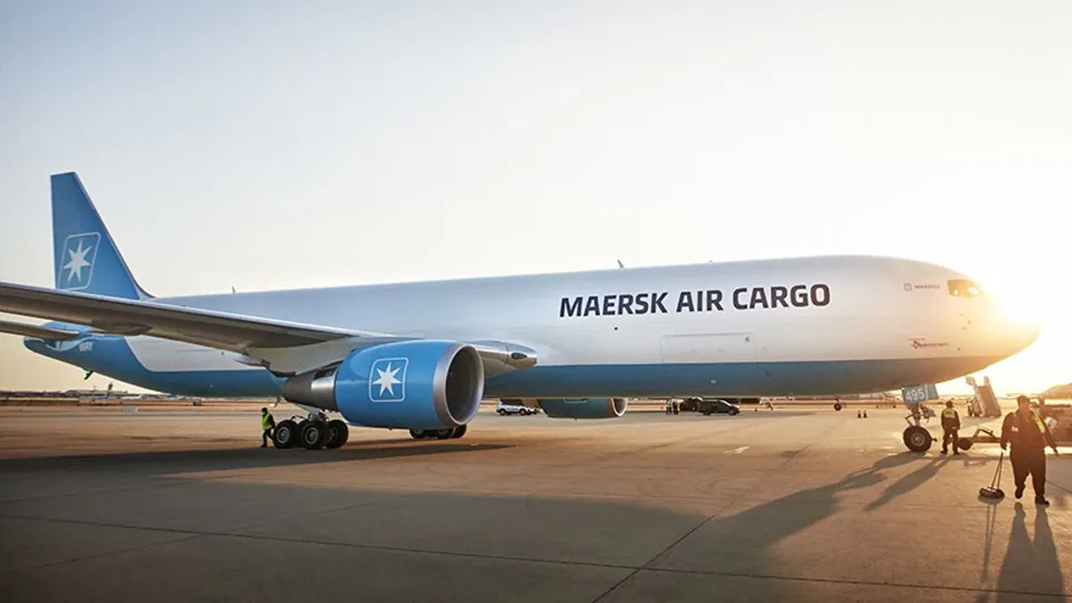 A Maersk Air Cargo branded aircraft sits on a tarmac.