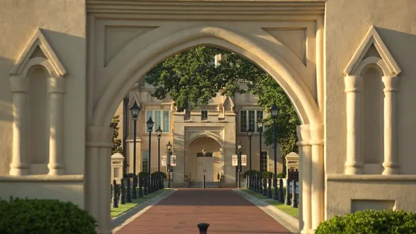 A view of a Georgia Military College entrance through an archway.