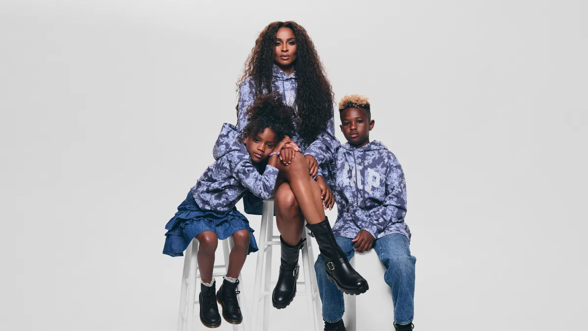 Ciara is pictured with two of her children wearing the same sweatshirt.