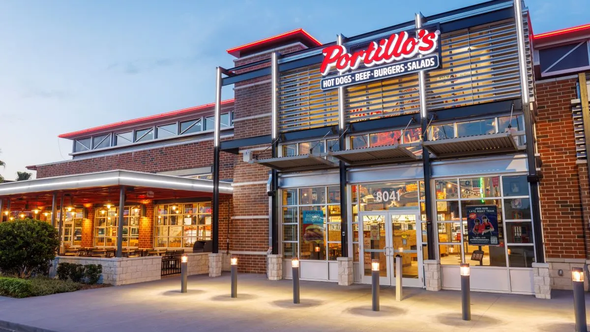 An evening shot of a Portillo's restaurant