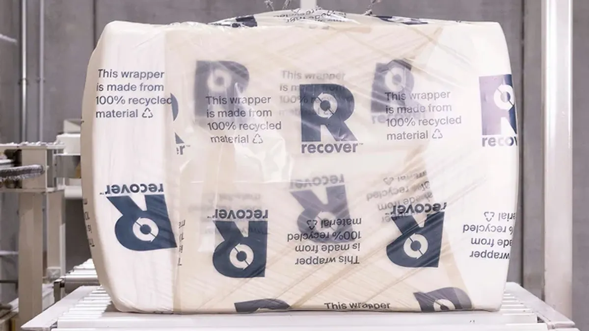 Recover's recycled cotton is on a factory conveyer belt.