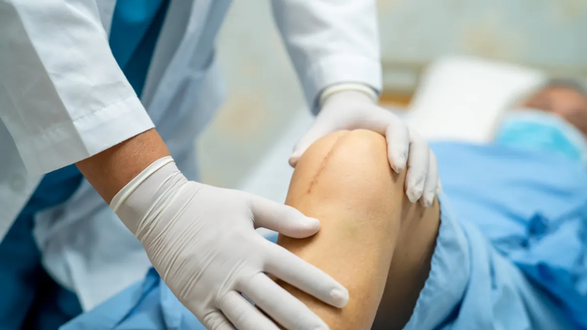 A patient recovers after a total knee replacement surgery.