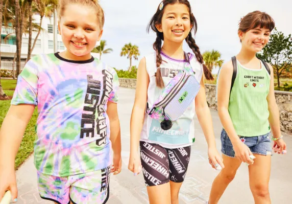 Three kids wear apparel from the Justice and Minecraft collaboration, available at Walmart.