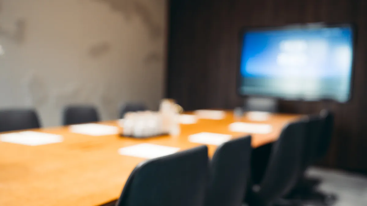 An empty meeting room with a conference table.