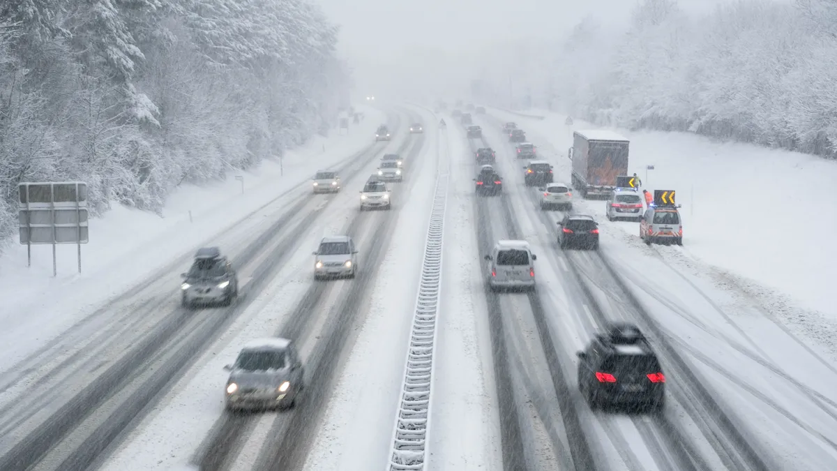 Cars on snowy roads.