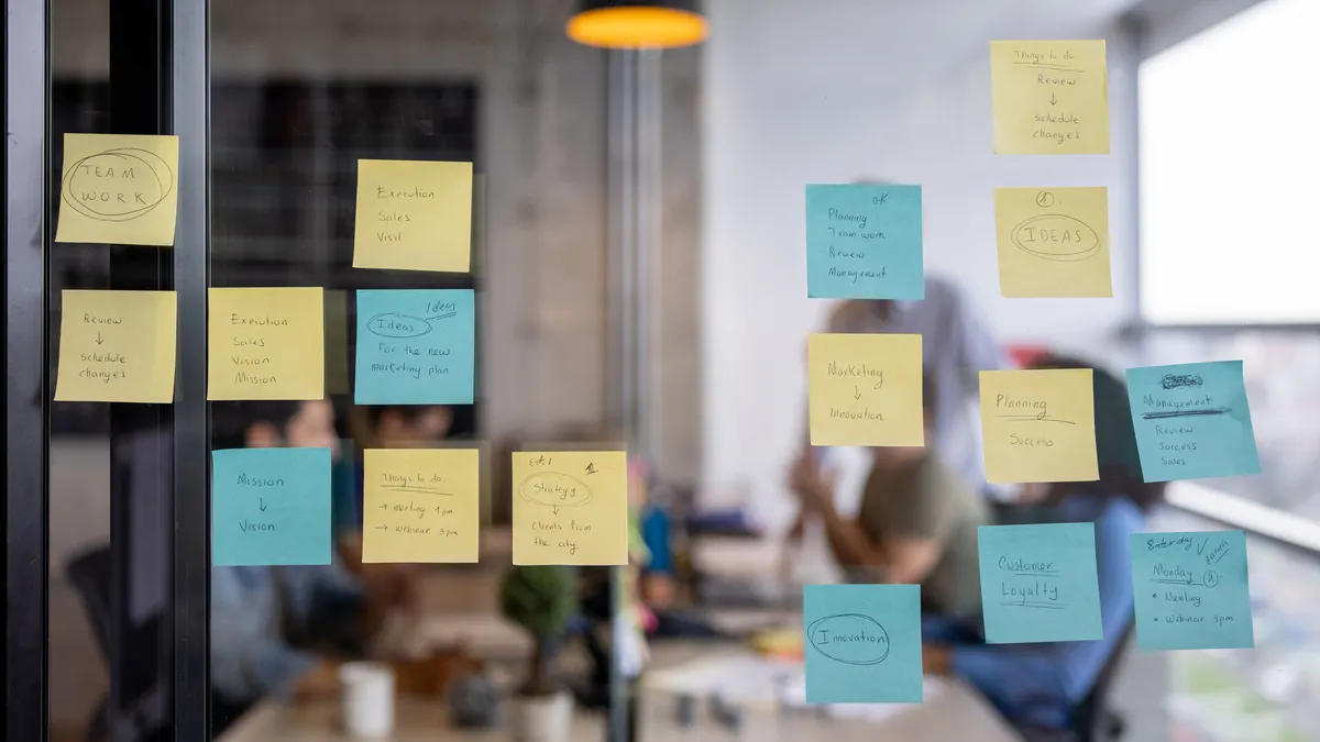 Post-its on a glass wall