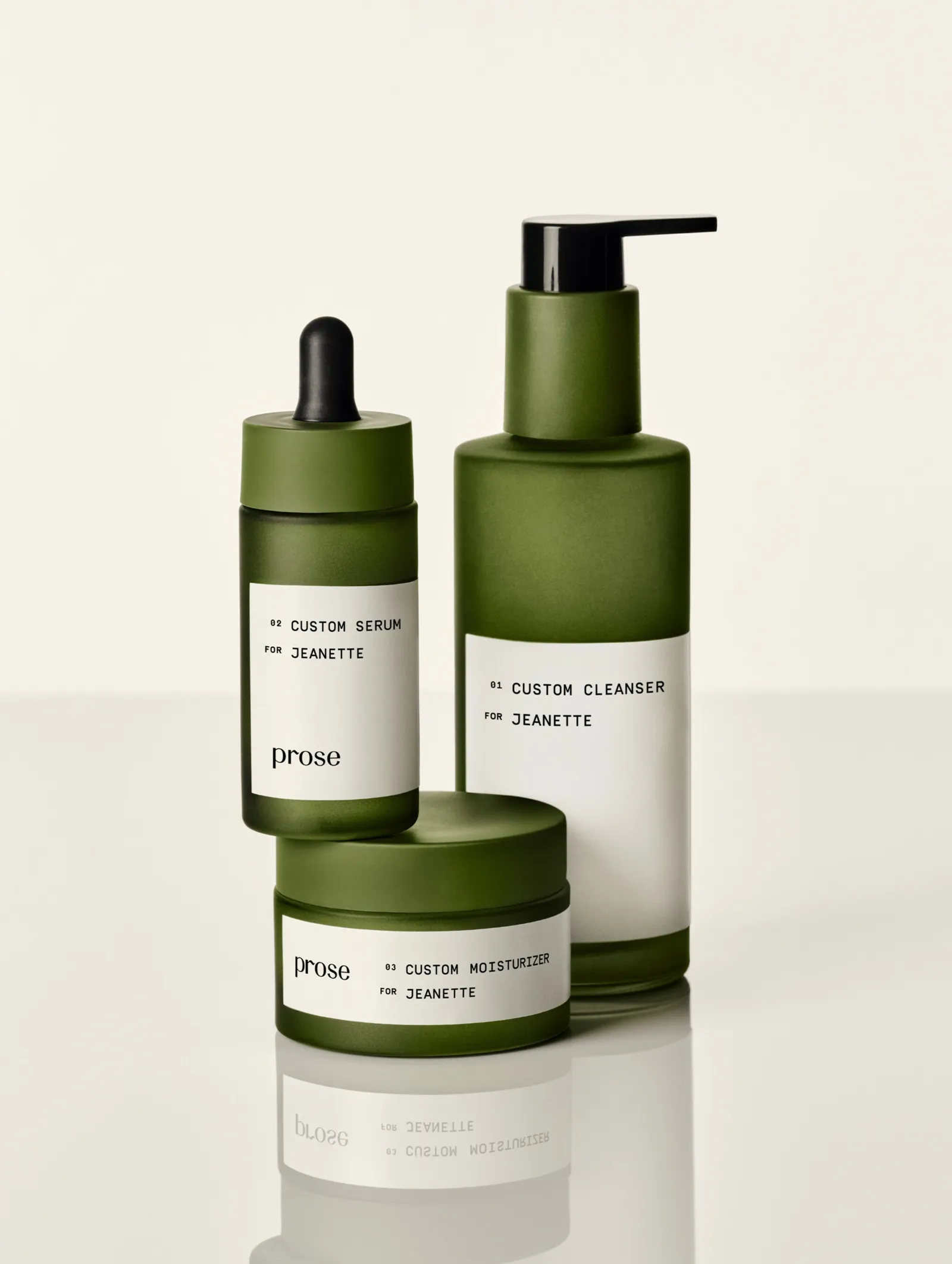 Three green skin care bottles from Prose with white labels