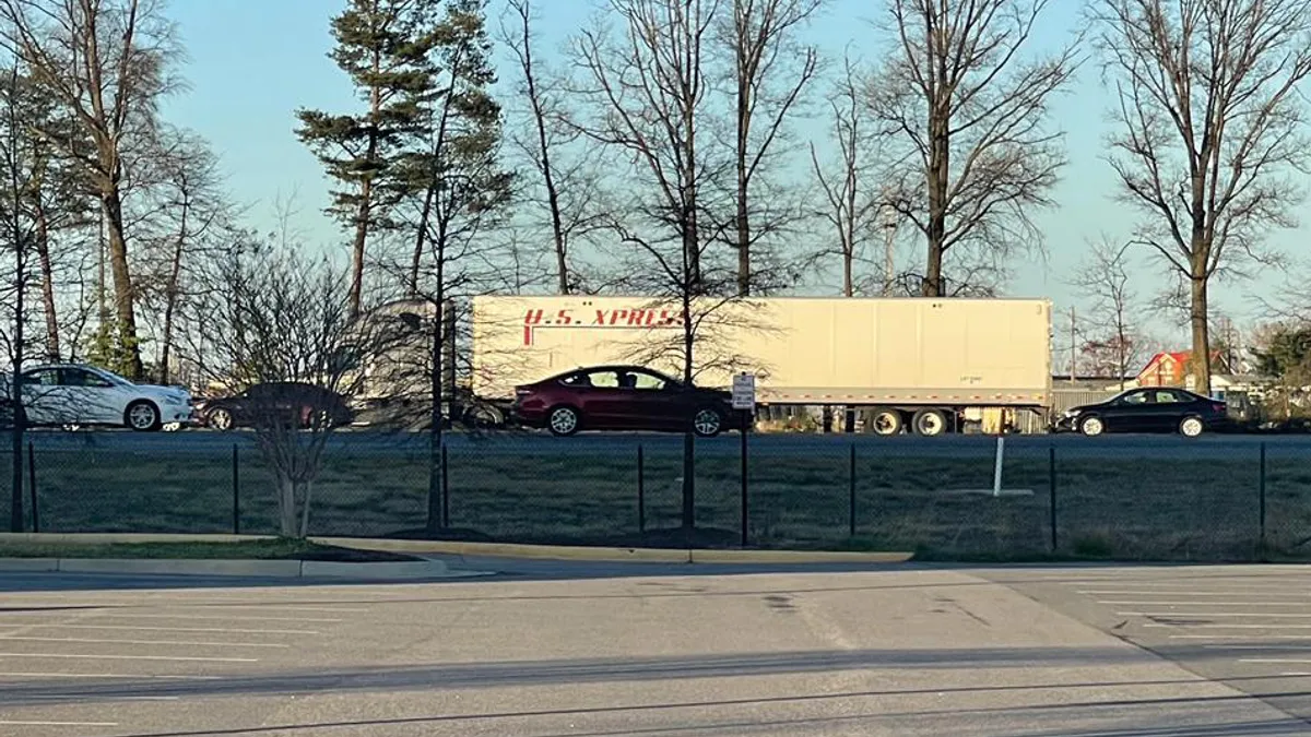 A U.S. Xpress trailer is hauled on I-95 in Virginia in March 2023.