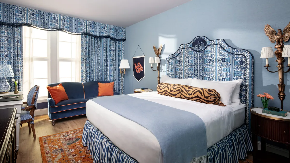 A guest room features a tiger-striped pillow.