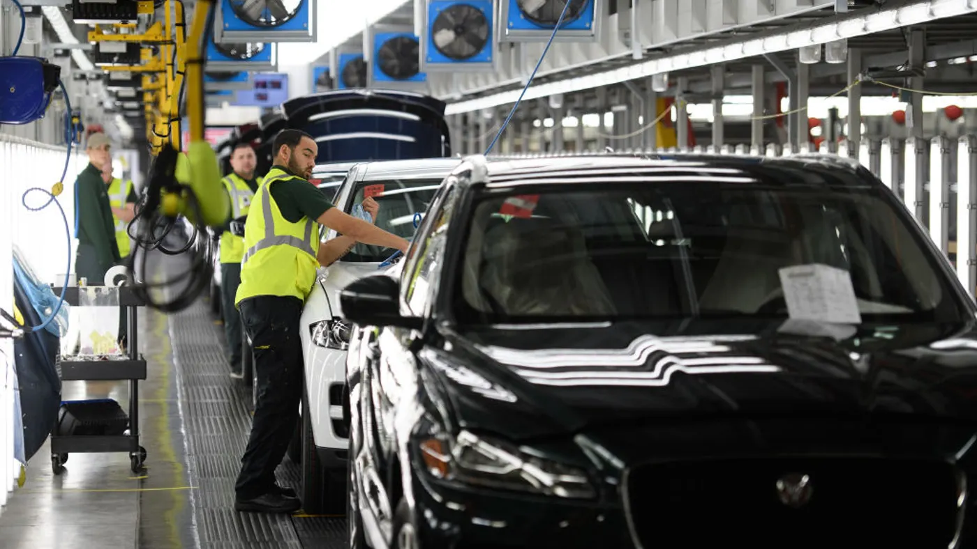 Vehicles are checked before moving to the next stage of production at the Jaguar Land Rover factory on March 1, 2017 in Solihull, England. The company paused production following a September 2025 cyberattack.