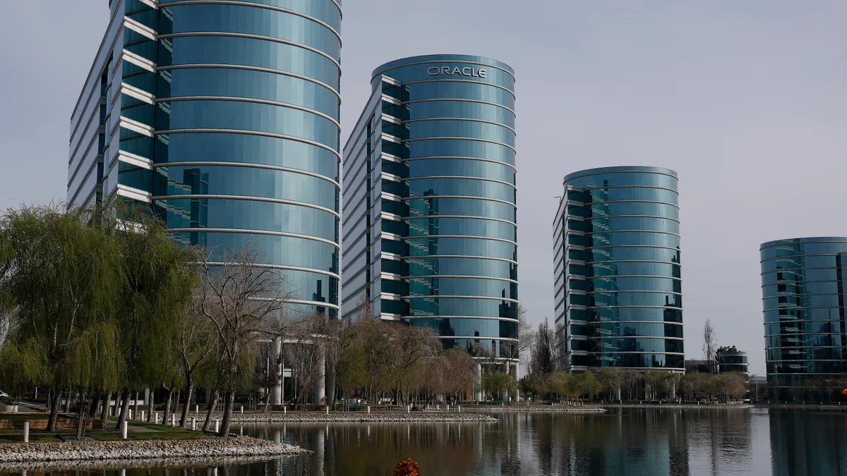 The Oracle logo is displayed on a building at an Oracle campus on March 10, 2025 in Redwood Shores, California.