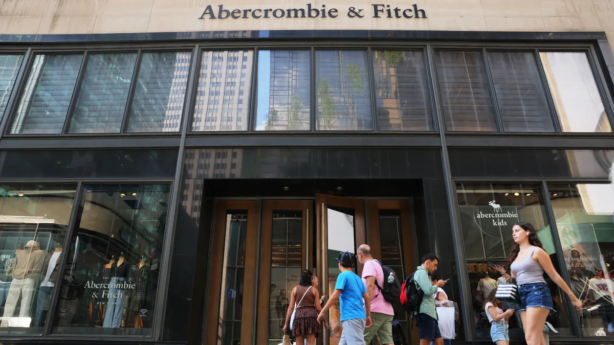 People walk in front of an Abercrombie and Fitch storefront in New York.