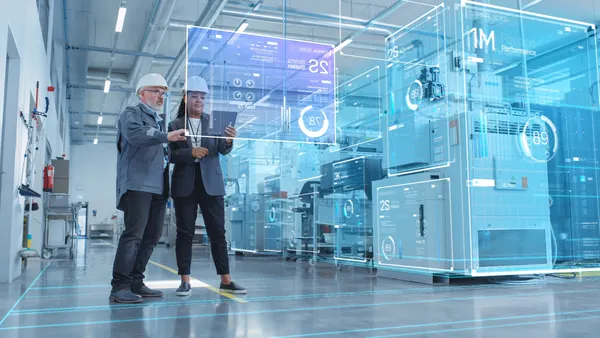 Two Industrial Engineers Using Tablet Computer