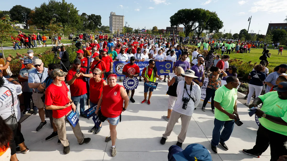 United Auto Workers members and others rally.