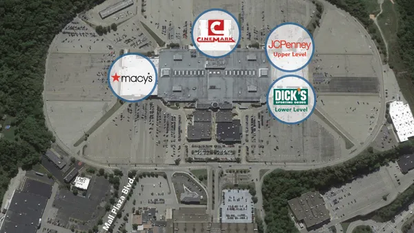 An aerial photo of the Monroeville Mall with graphics indicating the location of retailers within the center.