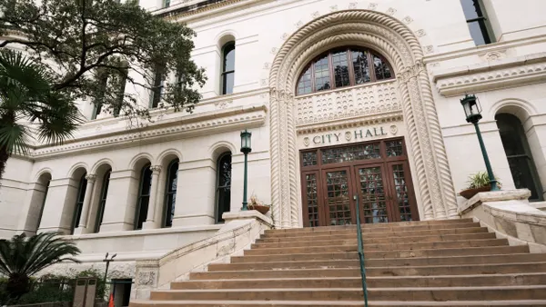 Stone building that says "City Hall."