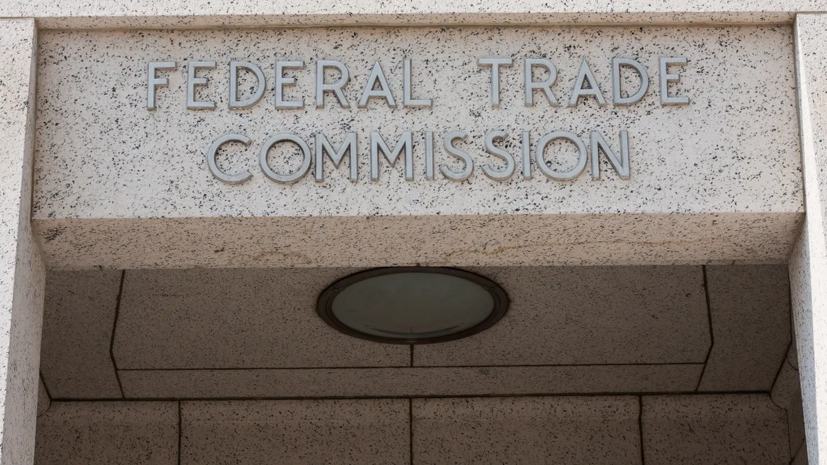 The Federal Trade Commission's marble entrance and building sign.