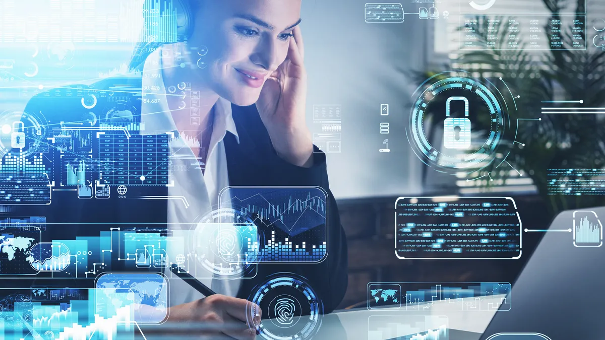 Smiling businesswoman in headphones taking notes, working with laptop and talking smartphone, blue glowing information protection icons. Padlock, cloud and digital interface. Cyber security concept - stock photo