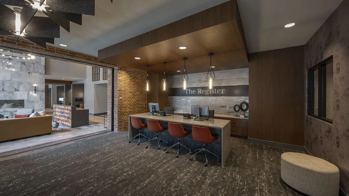 A table with chairs in a common area in a luxury apartment building