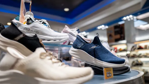 Skechers shoes on a display in a store.