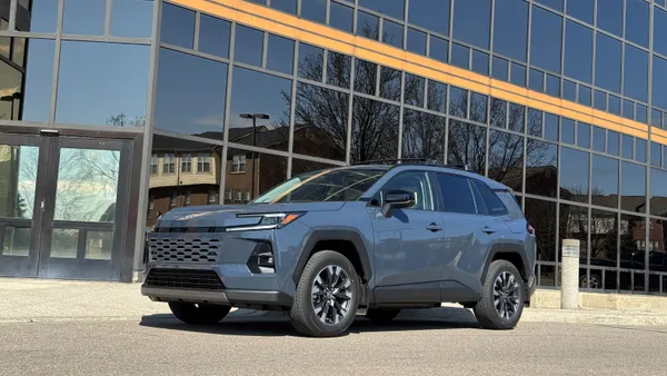 A 2026 Toyota RAV4 Limited sits in front of a building.