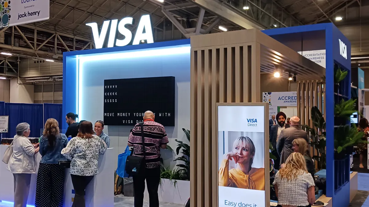 Visa booth with people standing in front at the Nacha Smarter Faster Payments conference New Orleans.
