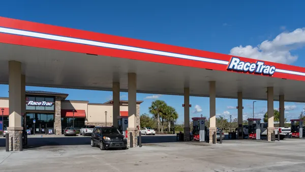 an overview of a racetrac gas station featuring company signage on a sunny day