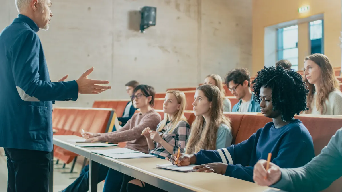 College professor teaching students in a classroom