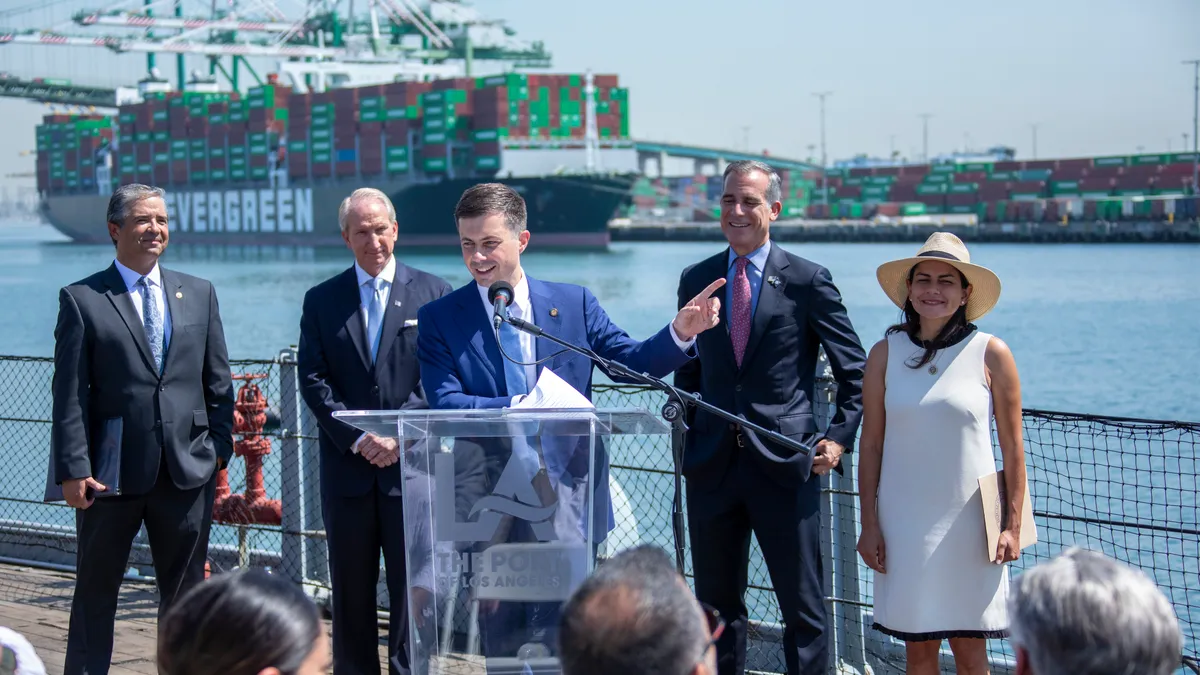 Transportation Secretary Pete Buttigieg speaks at a news conference at the Port of Los Angeles.