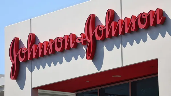 An exterior shot of the johnson and johnson logo in red outside the company's headquarters