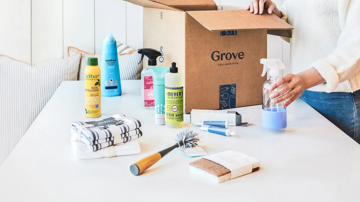 Cleaning bottles and towels laid on a table