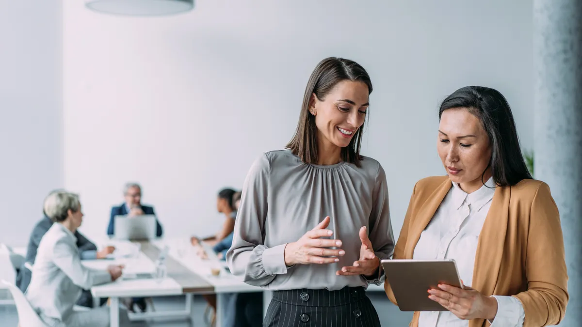 Female coworkers having a discussion