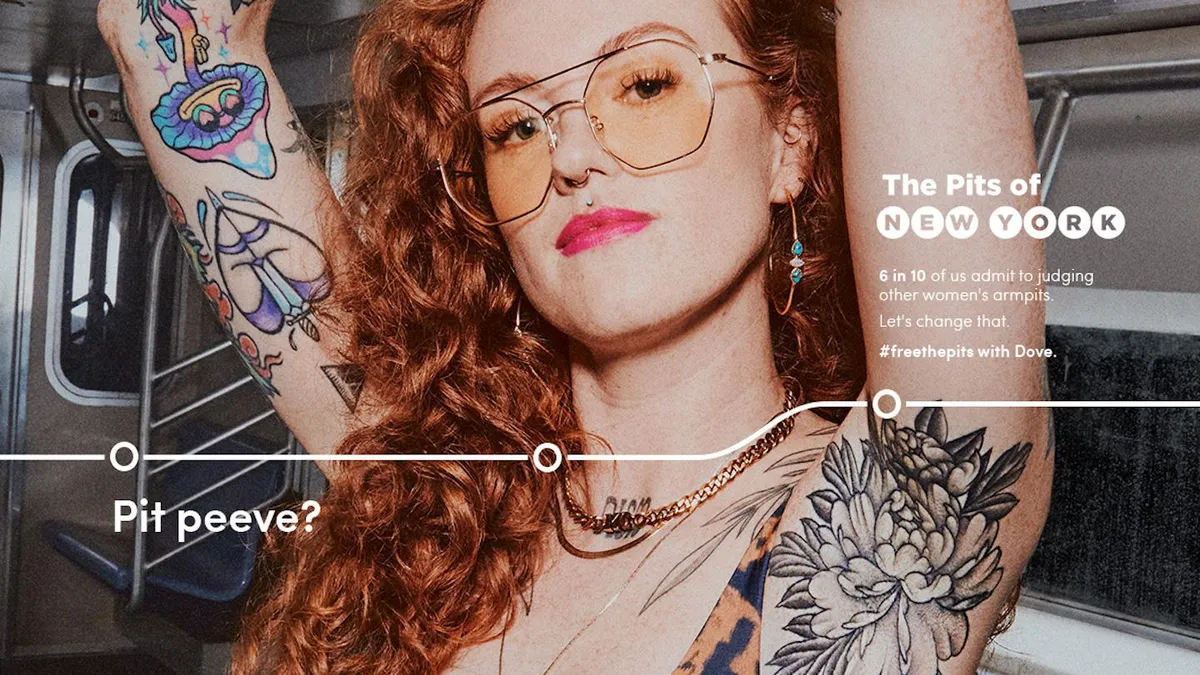 A woman shows off her underarm tattoos on the subway as part of a Dove campaign