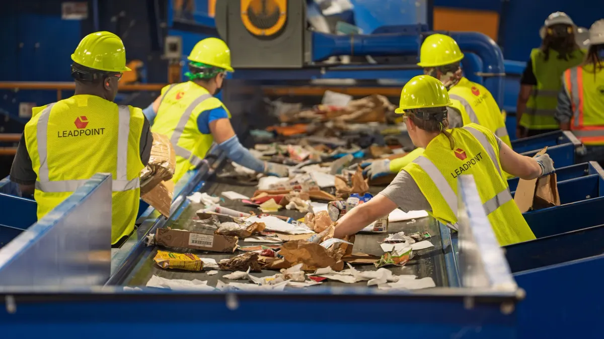 workers sort material at a MRF