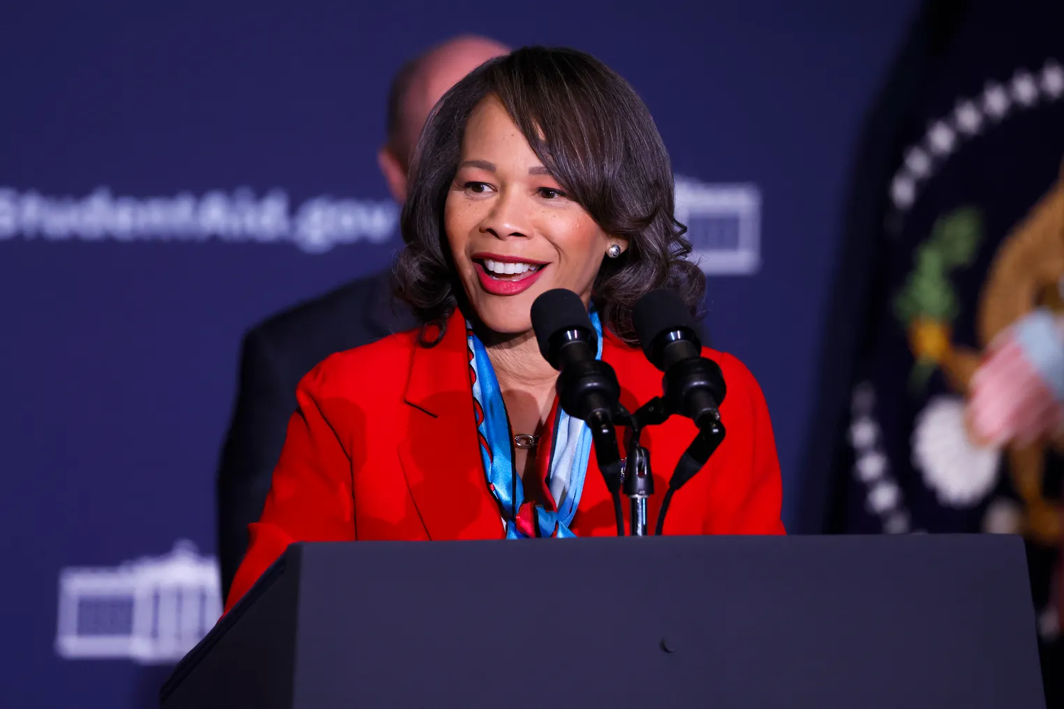 Lisa Blunt Rochester speaks at a podium.