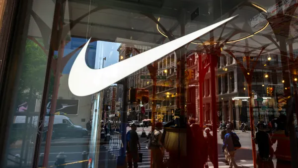 The iconic Nike swoosh design is displayed in a window of the athletic company's new store on Broadway in Manhattan on April 24, 2026 in New York City.