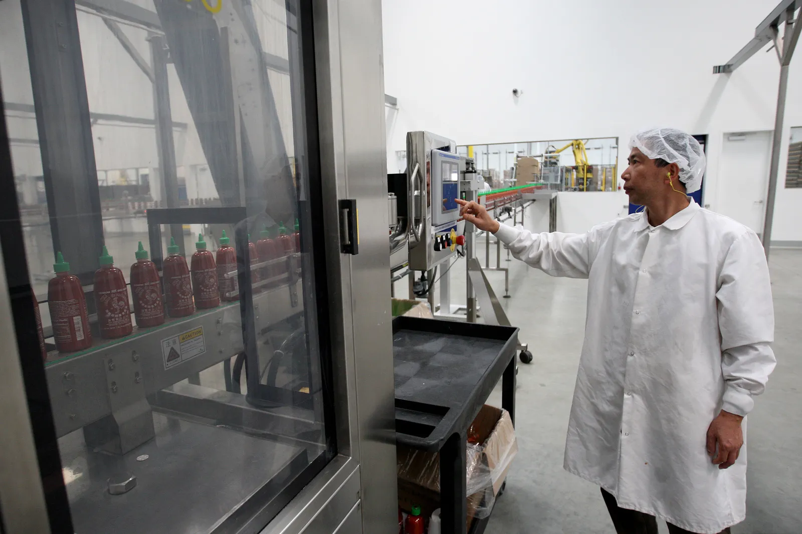 Sriracha Hot Chili Sauce is bottled at the Huy Fong Foods plant on May 14, 2014 in Irwindale, California.