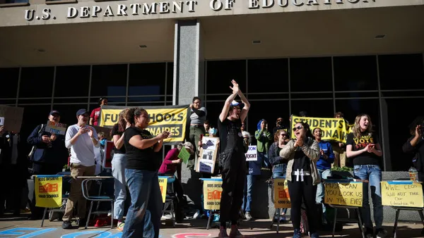 Activists gather in front of the U.S. Department of Education in protest of President Donald Trump's executive order to dismantle the agency.