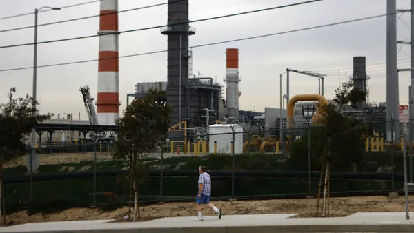 A man walks past the Scattergood Generating Station on February 12, 2019 in El Segundo, California.