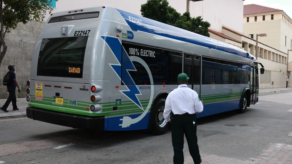 A 40-foot, battery-powered electric bus drives along a street on February 02, 2023 in Miami, Florida.