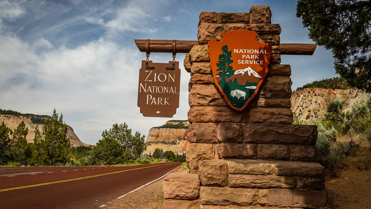 The official National Park Service sign that marks the east entrance to Zion National Park in Utah.