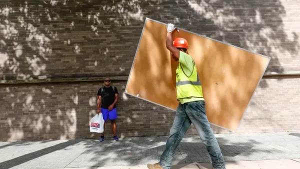 Construction worker walking on the campus of Yale University