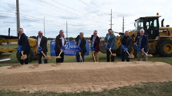 Project stakeholders hold a groundbreaking ceremony