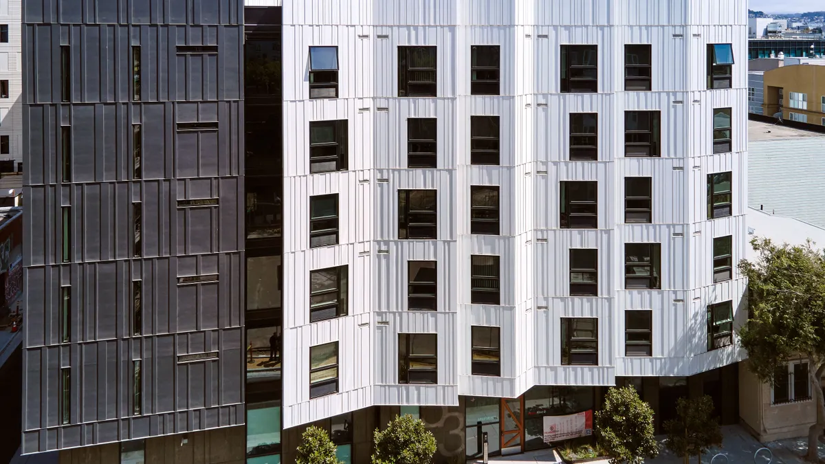 A picture shows a contemporary apartment building in San Francisco.