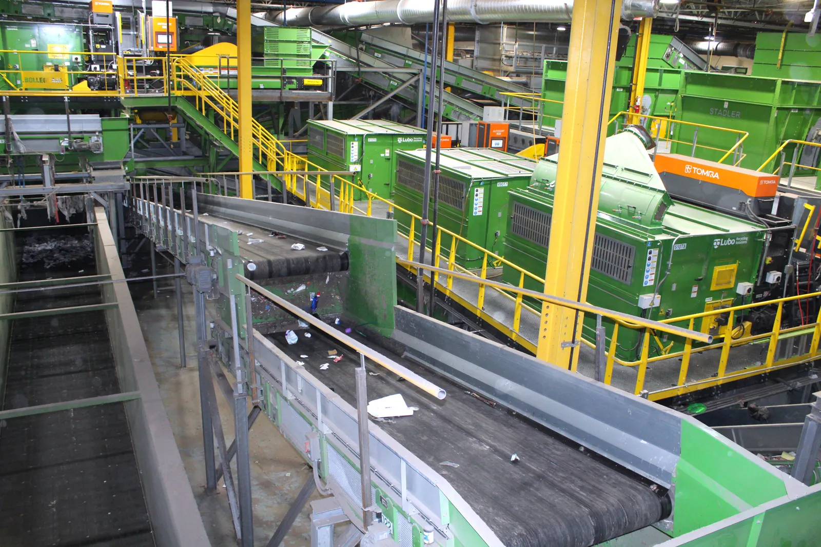 Industrial equipment and conveyors process materials for recycling.