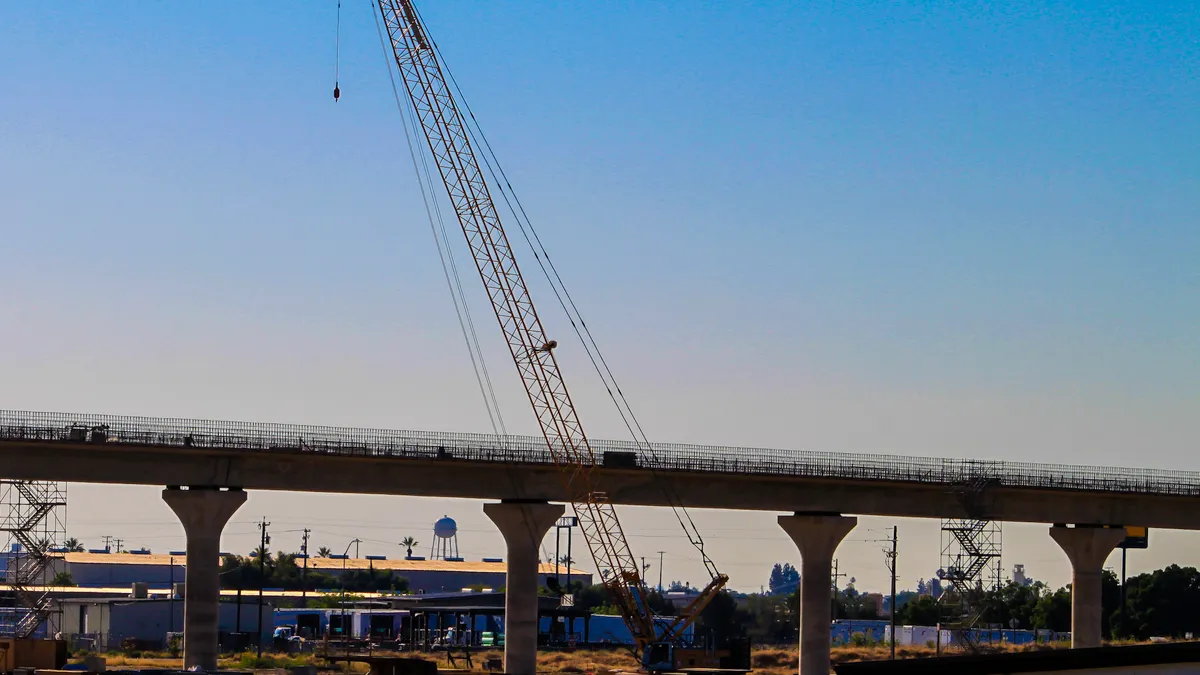 Cranes help construct a high-speed rail section near Fresno, California.