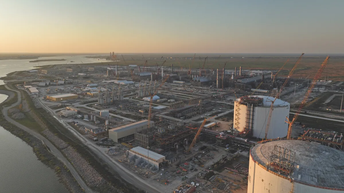 Aerial view of the Golden Pass LNG project being constructed on a shoreline.