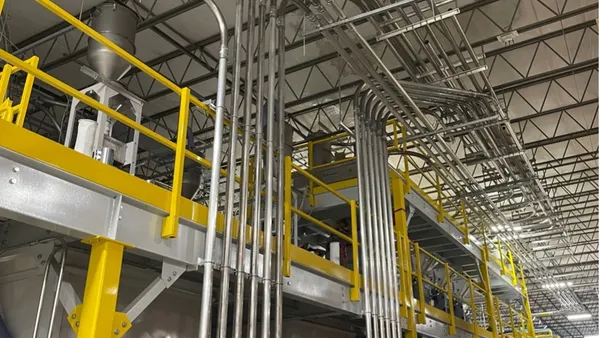 Pipes and machinery inside an industrial facility.