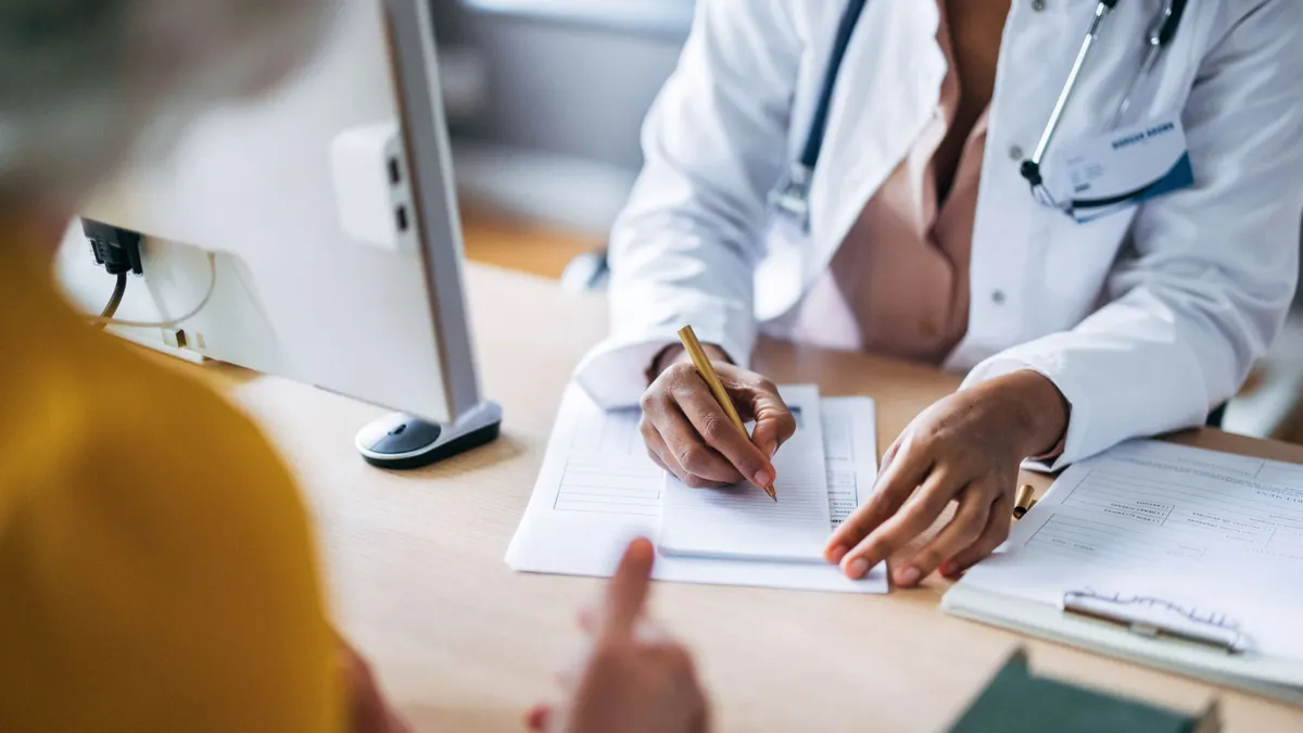 A doctor discusses results with a patient.