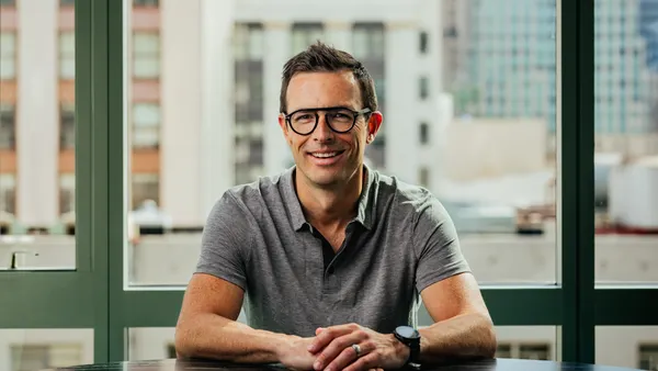 A headshot of Calvin McDonald.